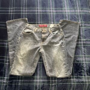 Vintage 2000s Nautica grey/ blue flare jeans with a cool yellow fade. Size 4